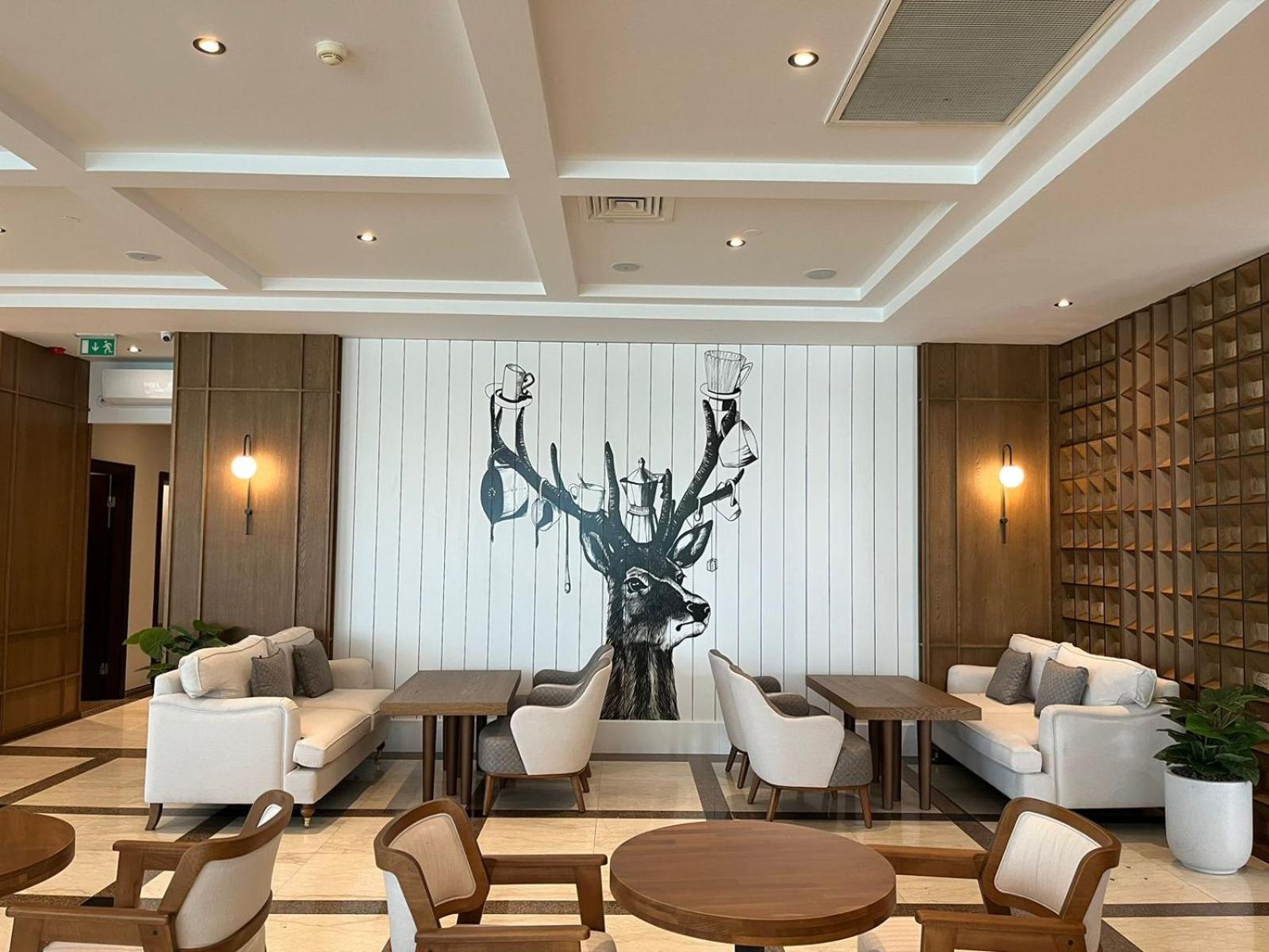Grand Hotel Victory Актау Экстерьер фото The lounge at the airport
